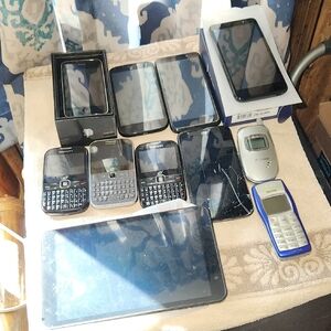 Bundle Of Old Cell Phones And Pad